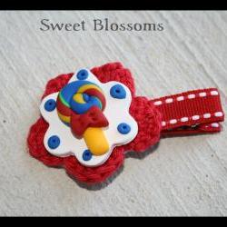 crochet flower hair clip topped up with polymer clay bead 